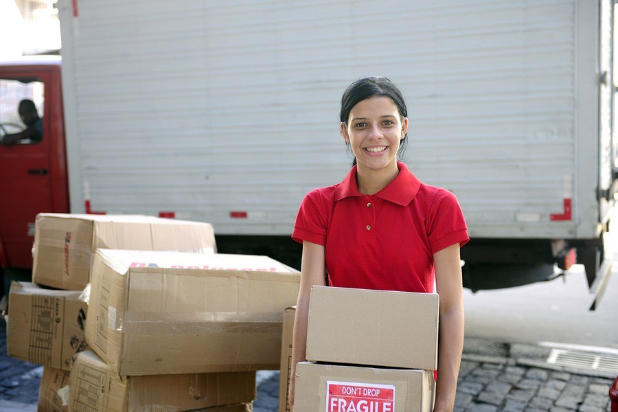 moving girl with boxes in mississippi