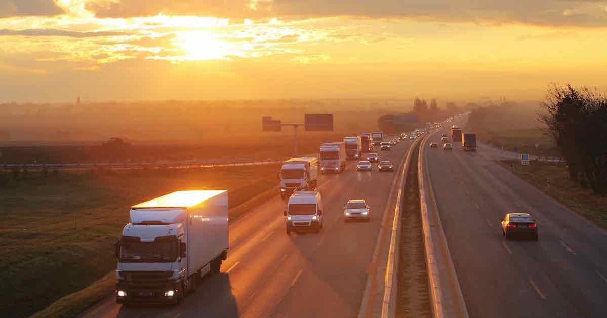 cars and trucks at sunrise