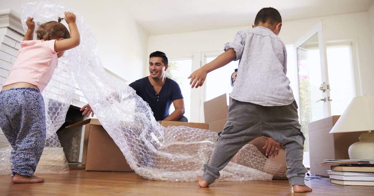 family-unpacking-boxes-in-new-home