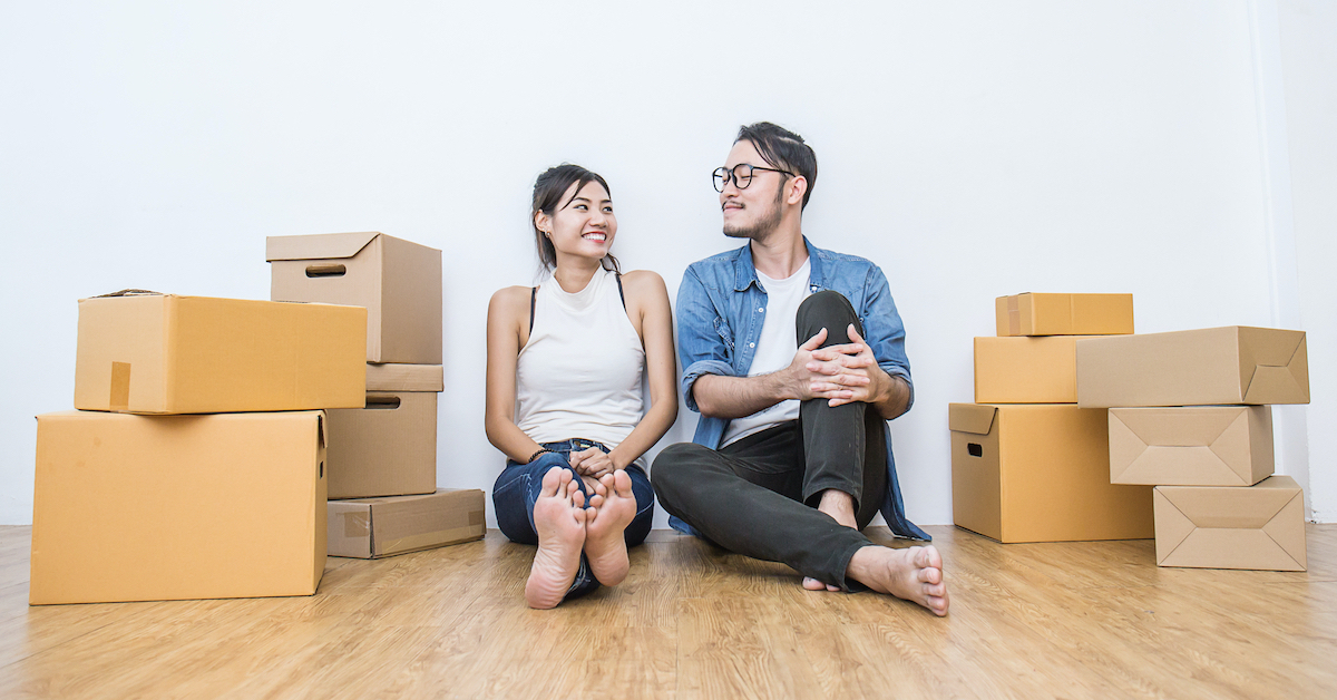 Young couple packing and moving their house